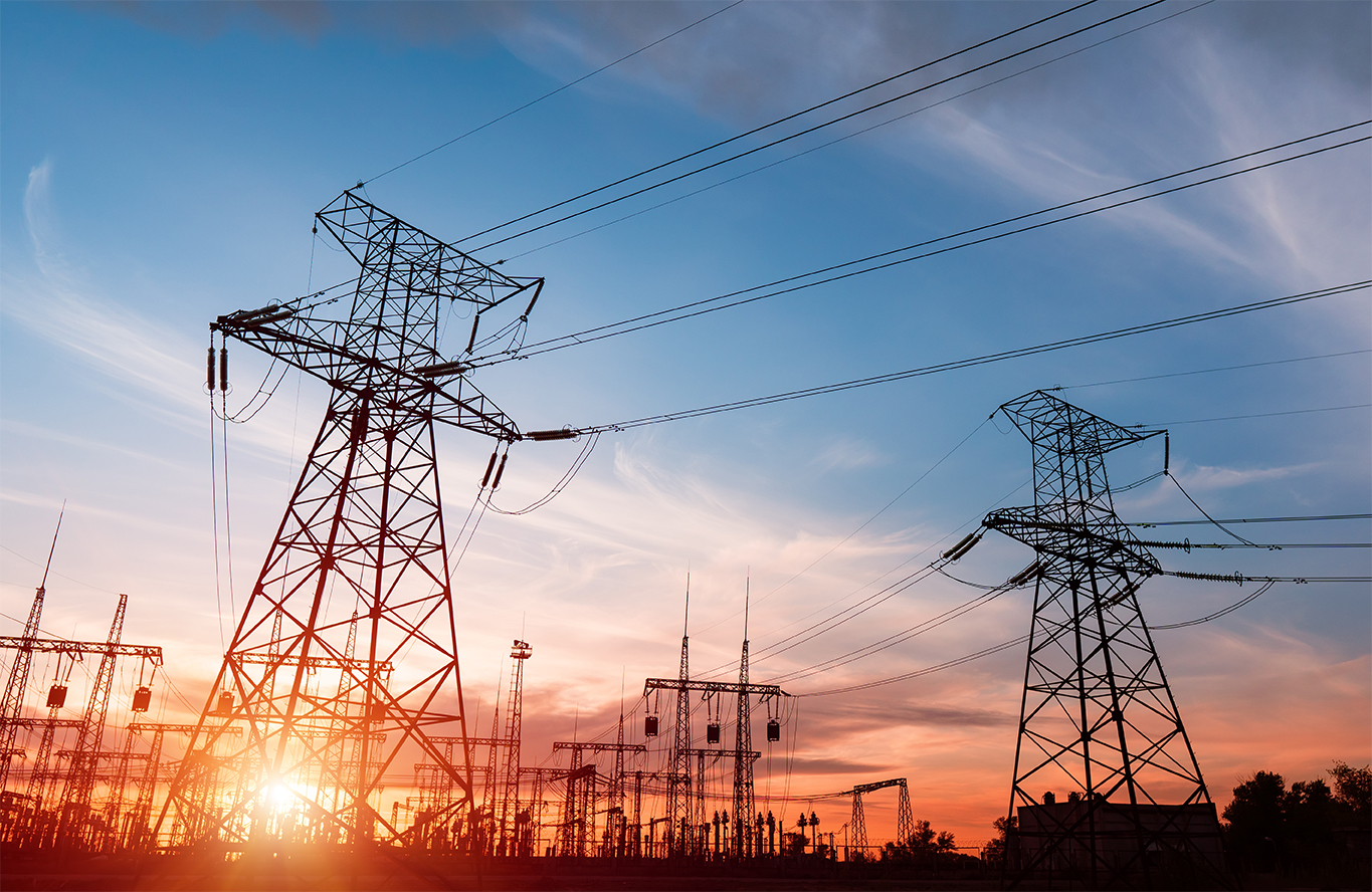 High-voltage power lines. Electricity distribution station. high voltage electric transmission tower. Distribution electric substation with power lines and transformers.